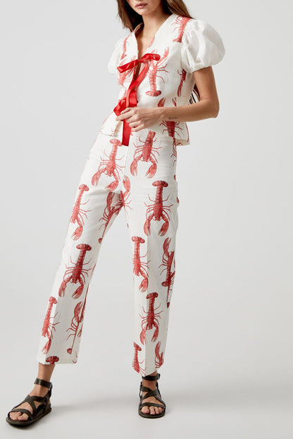 Conjunto de dos piezas con estampado animal, cuello en V, manga corta y lazo