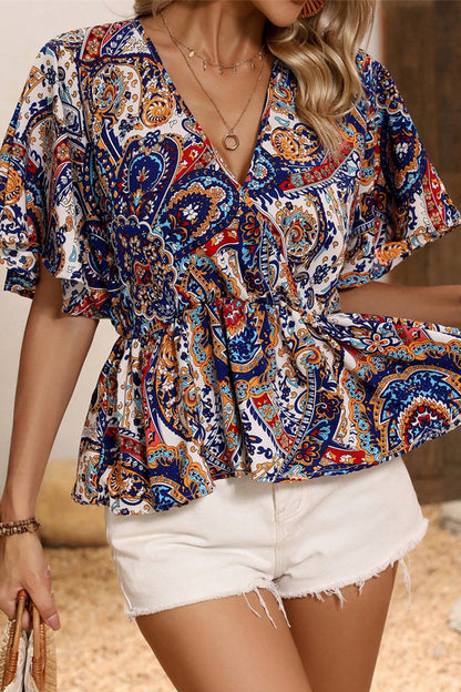 Elegantes blusas con cuello en V y volantes con estampado de tótem nacional