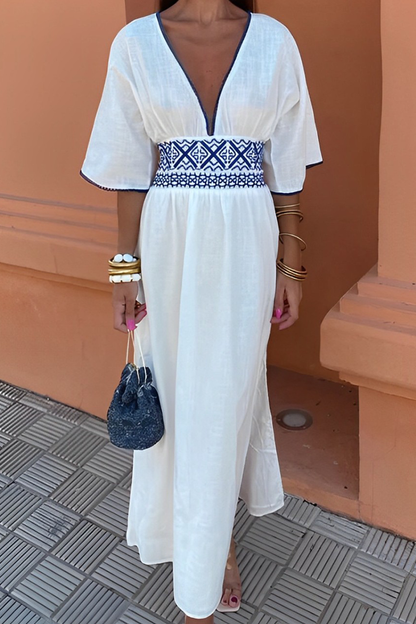 Elegante vestido de corte A con escote en V y estampado geométrico