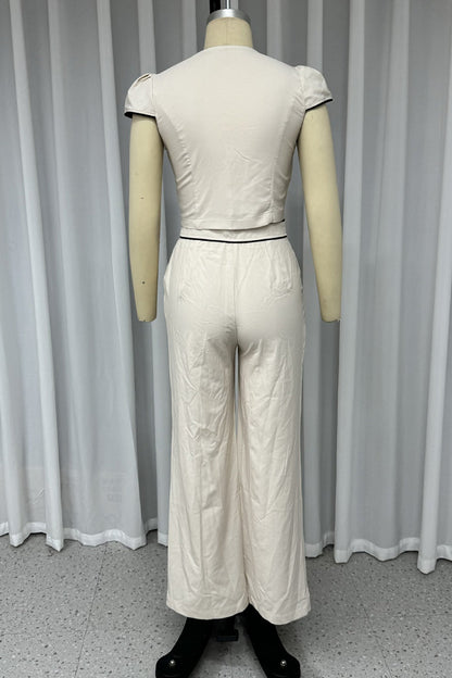 Conjunto informal de dos piezas con cuello en V, manga corta, bolsillos, botones y color liso