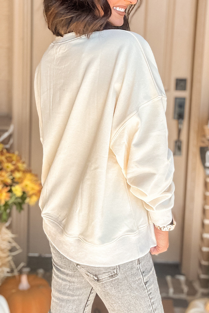 Sudadera informal con cuello redondo y parche de calabaza