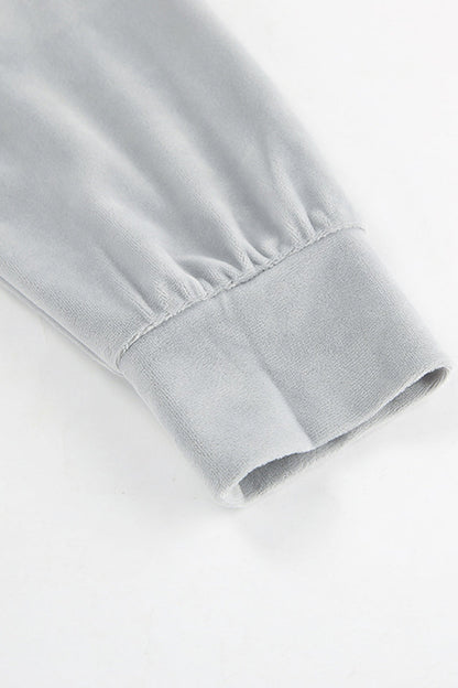 Conjunto informal de dos piezas con cuello vuelto, manga larga y bolsillos de calle con cordones
