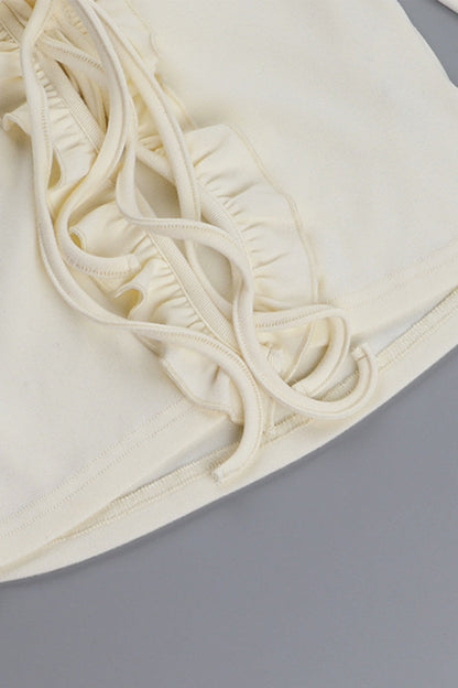 Blusa informal con cuello en V, aberturas y cordones con orillo fibroso