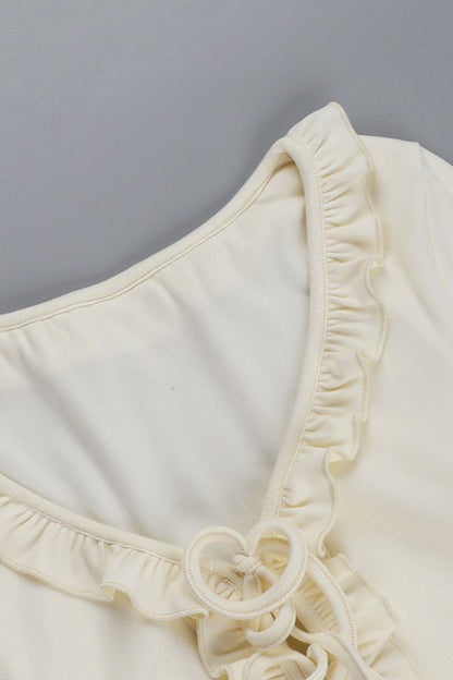 Blusa informal con cuello en V, aberturas y cordones con orillo fibroso