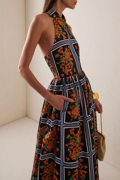 Elegante vestido de falda de un solo paso con halter y contraste con estampado floral