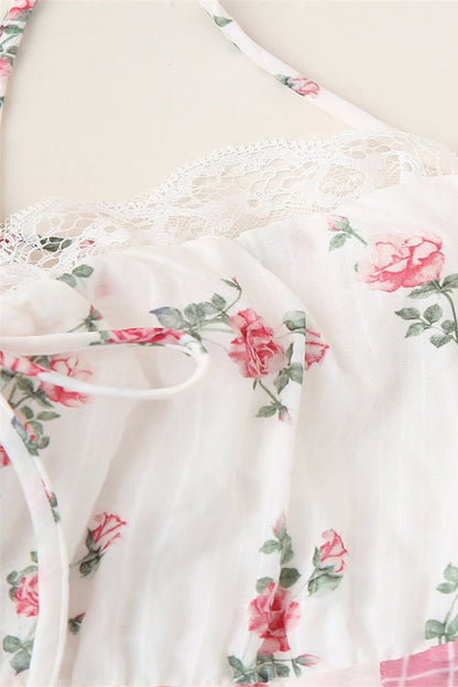 Elegante vestido largo con cuello halter, espalda descubierta, encaje y cordón ajustable con estampado floral