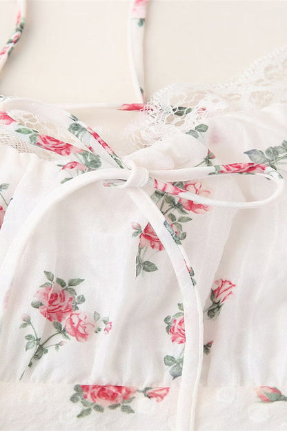 Elegante vestido largo con cuello halter, espalda descubierta, encaje y cordón ajustable con estampado floral