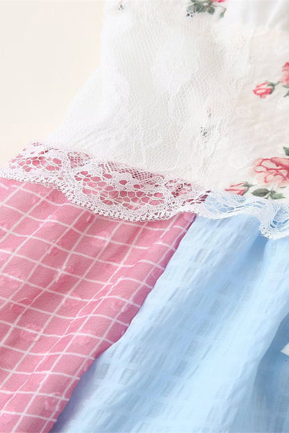Elegante vestido largo con cuello halter, espalda descubierta, encaje y cordón ajustable con estampado floral