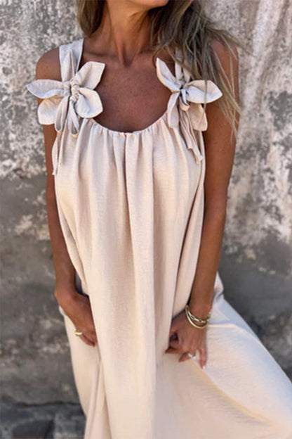 Vestidos casuales de tirantes con cuello en U y flores en color liso