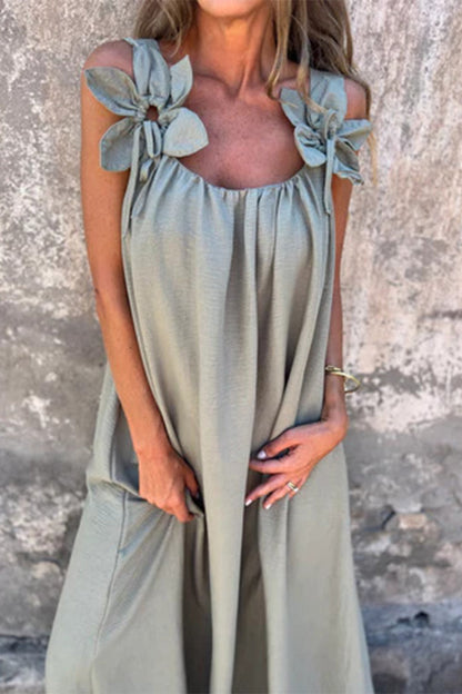 Vestidos casuales de tirantes con cuello en U y flores en color liso