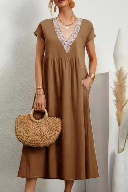 Vestido informal de color liso con bolsillos, escote en V y manga corta