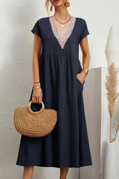 Vestido informal de color liso con bolsillos, escote en V y manga corta