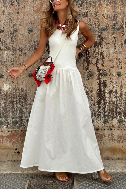Vestido largo blanco con cintura suelta, cuello redondo, sin mangas y dobladillo