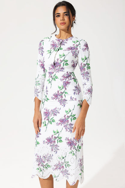 Vestido largo con bordado inglés, cuello redondo y manga larga con estampado floral 