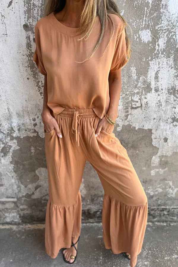 Conjunto de top casual de manga corta con cuello redondo y cintura elástica con bolsillo para atar y pantalones anchos de color liso