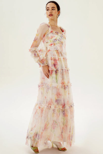 Vestido largo rosa con volantes y mangas largas con estampado floral 