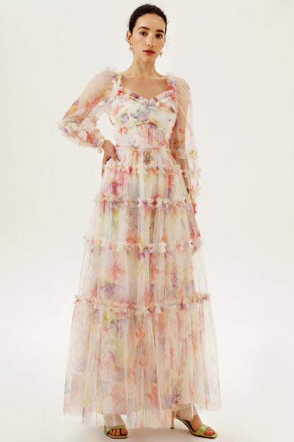 Vestido largo rosa con volantes y mangas largas con estampado floral 