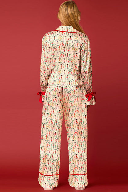 Conjunto de top de terciopelo con estampado navideño, manga larga, bolsillos y pantalones anchos con cintura elástica.