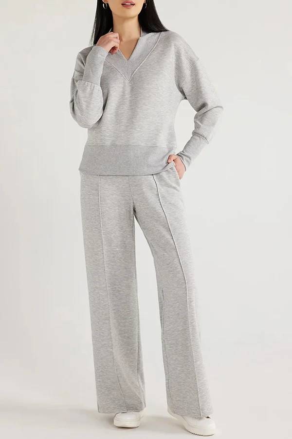 Conjunto de top de cuello en V y pantalones de estar por casa con bolsillos y cintura elástica de color liso para el frío 