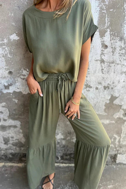 Conjunto de top casual de manga corta con cuello redondo y cintura elástica con bolsillo para atar y pantalones anchos de color liso