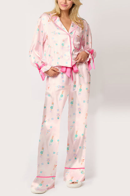 Conjunto de top de terciopelo con estampado navideño, manga larga, bolsillos y pantalones anchos con cintura elástica.