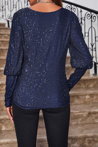 Top holgado de manga larga con cuello redondo y lentejuelas de color liso
