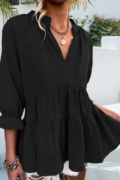 Blusa informal holgada de color liso con cuello en V y manga larga