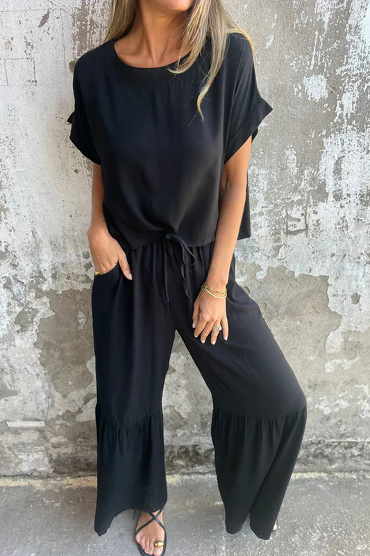 Conjunto de top casual de manga corta con cuello redondo y cintura elástica con bolsillo para atar y pantalones anchos de color liso