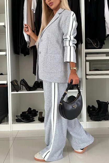 Conjunto de blazer deportivo con solapa de patchwork y pantalón holgado con cintura elástica y bolsillos.