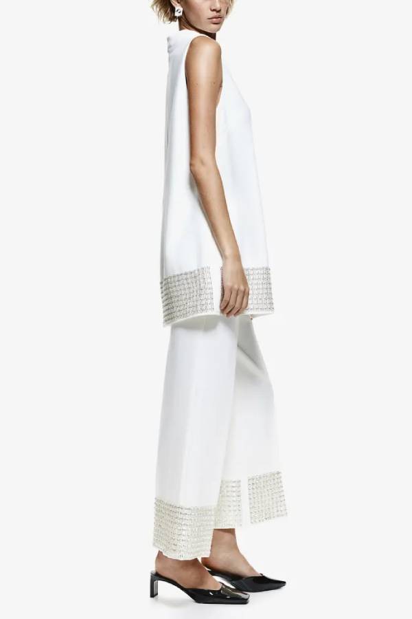 Pantalones cortos holgados con cintura elástica y ribete de lentejuelas en la espalda, sencillos pero no sencillos