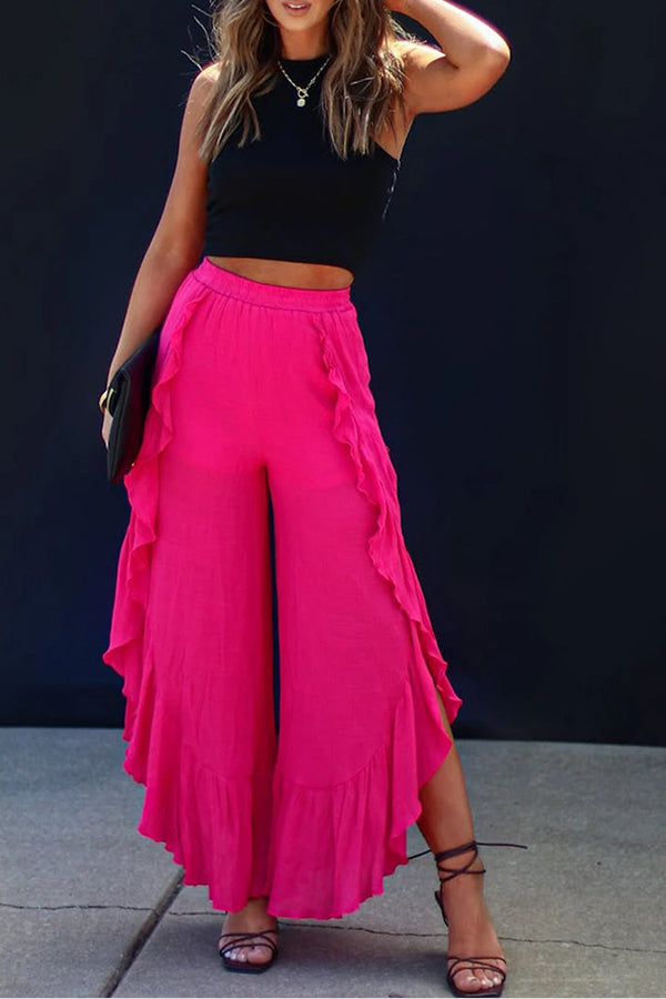 Pantalones anchos de cintura alta con abertura y volantes de rosas