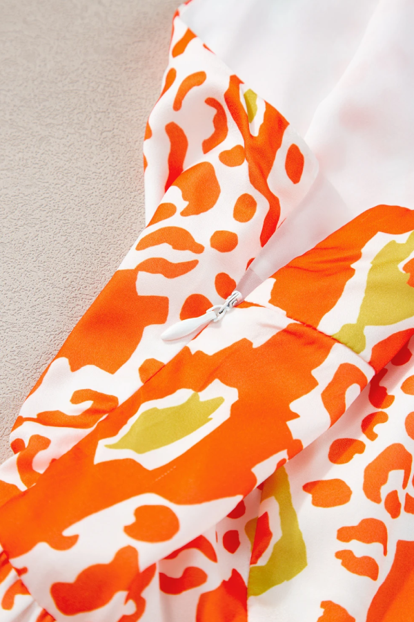 Vestido escalonado con bloques de color de leopardo y tirantes anudados en naranja