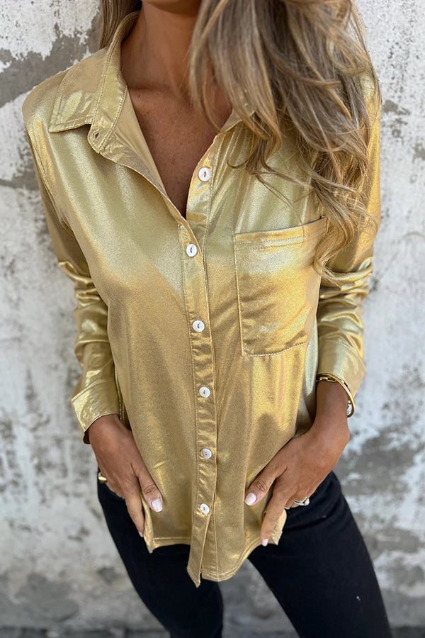 Blusa holgada con botones y bolsillos metalizados de aspecto festivo
