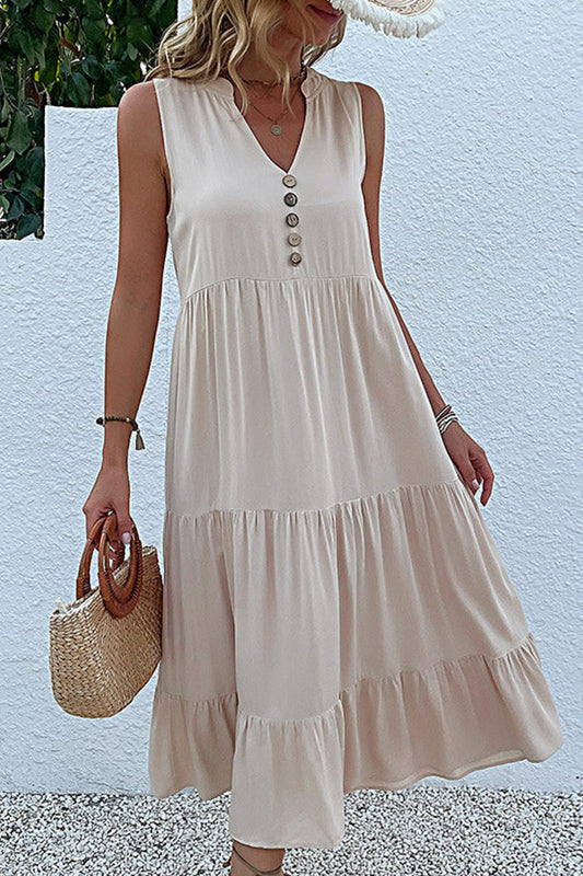 Vestido tipo chaleco informal, suelto, sin mangas y de color liso. 