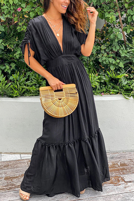 Vestido largo negro con volantes, mangas kimono, plisado y cordón ajustable