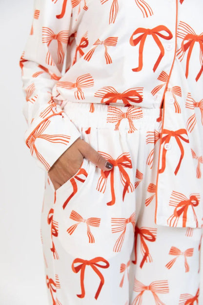 Conjunto de camisa de manga larga con estampado de lazo navideño y pantalón con bolsillo en la cintura elástica