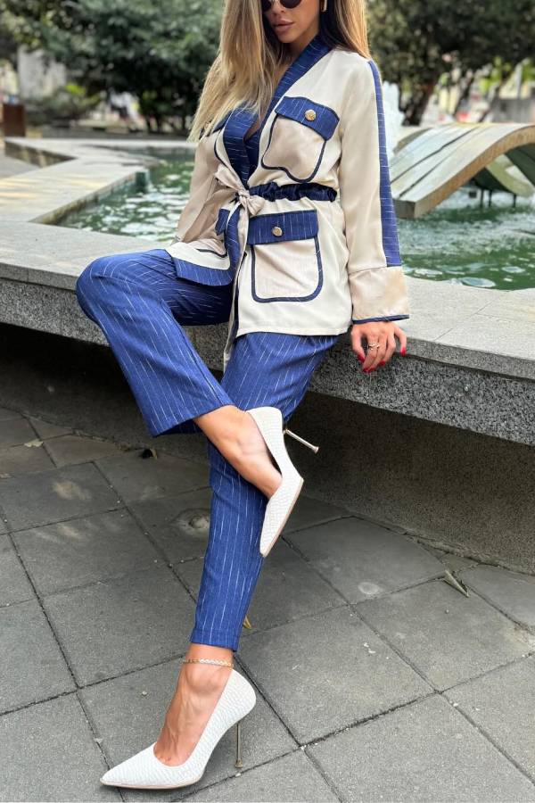Conjunto de top con bolsillo con solapa y cordón de retazos de Halston y pantalón holgado con cintura elástica a rayas