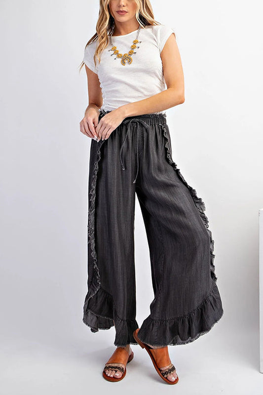 Pantalones vaqueros holgados acampanados con cintura elástica y volantes de color liso