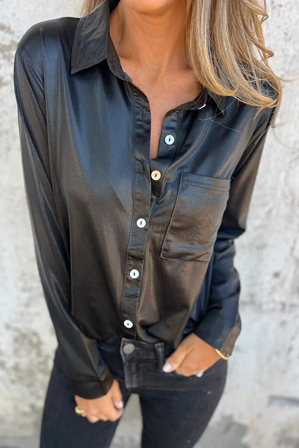 Blusa holgada con botones y bolsillos metalizados de aspecto festivo
