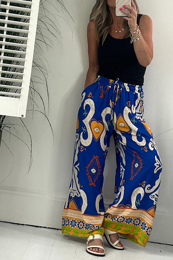 Pantalones con cintura elástica y cordón ajustable con bolsillos y estampado de Reina de Corazones