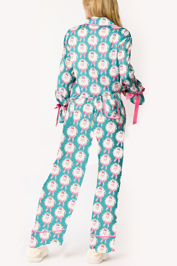 Conjunto de top de terciopelo con estampado navideño, manga larga, bolsillos y pantalones anchos con cintura elástica.