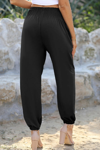 Joggers negros de cintura alta con bolsillos y fruncido