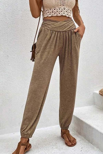 Pantalones casuales de cintura alta con bolsillos sueltos y temperamento