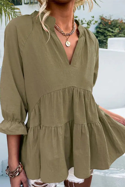 Blusa informal holgada de color liso con cuello en V y manga larga