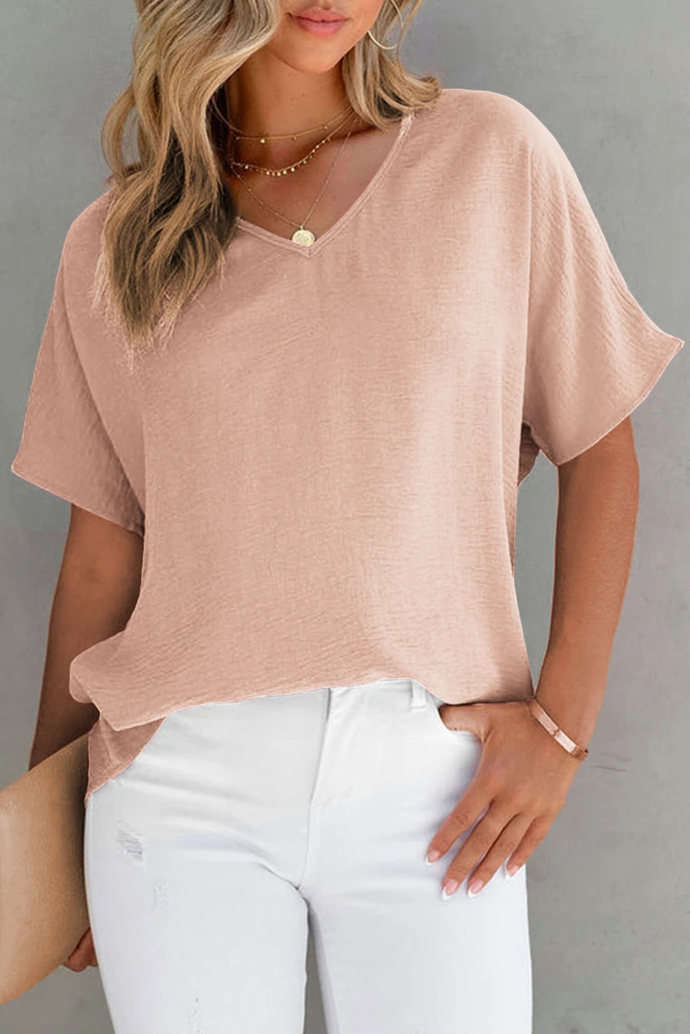 Blusa de manga corta con cuello en V y color liso