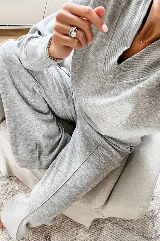 Conjunto de top de cuello en V y pantalones de estar por casa con bolsillos y cintura elástica de color liso para el frío 
