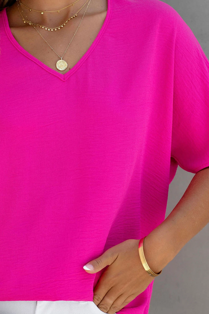 Blusa de manga corta con cuello en V y color liso