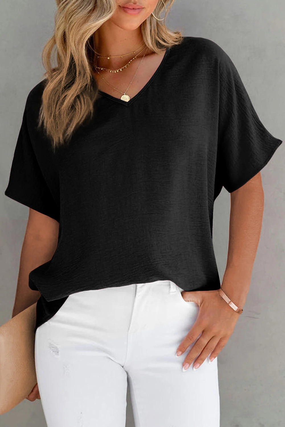 Blusa de manga corta con cuello en V y color liso