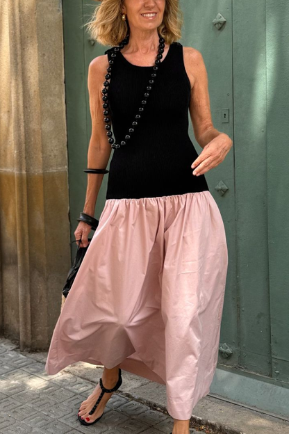 Vestido largo de punto negro sin mangas con dobladillo suelto rosa