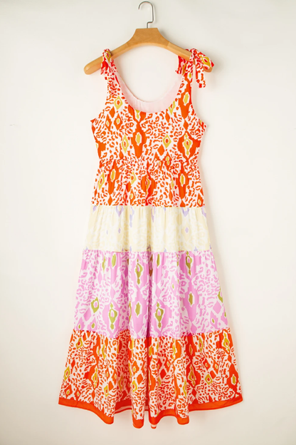 Vestido escalonado con bloques de color de leopardo y tirantes anudados en naranja